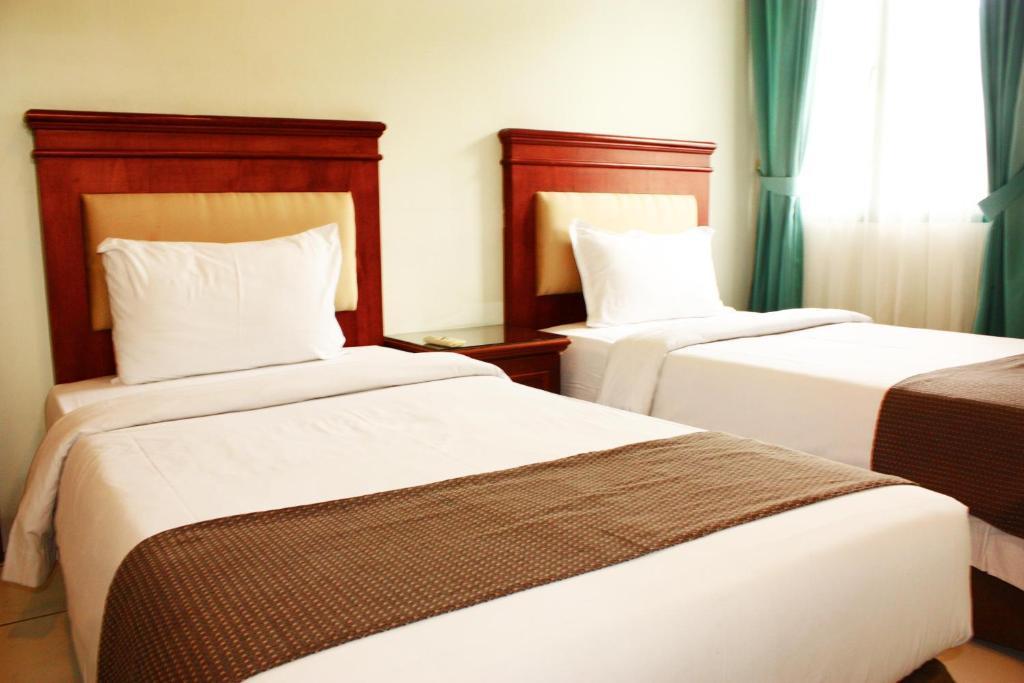 Travellers Suites Serviced Apartments Medan Kamer foto